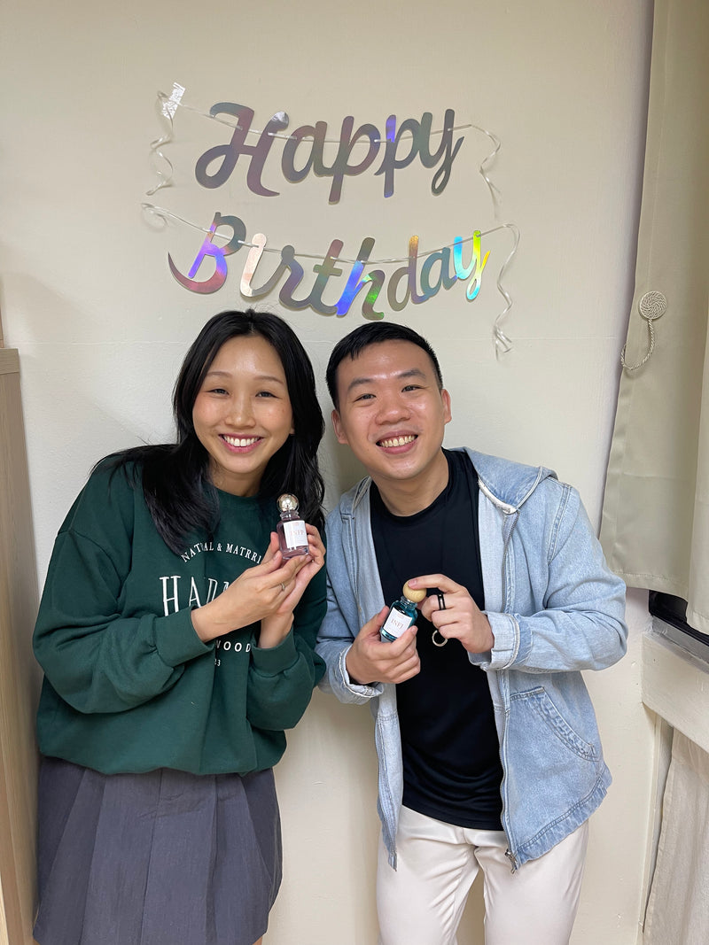 Two guests celebrating a birthday with their personalised perfumes