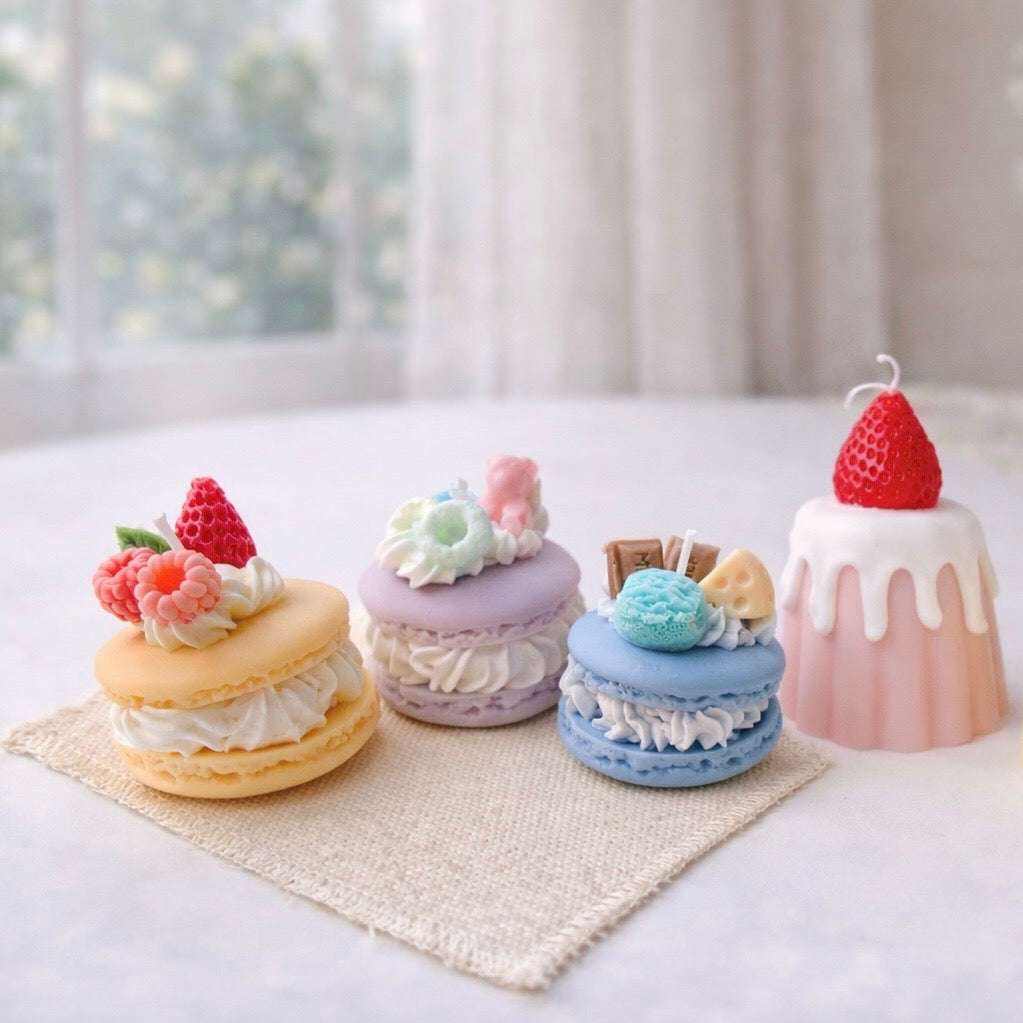 A colourful collection of handmade macaron and dessert candles
